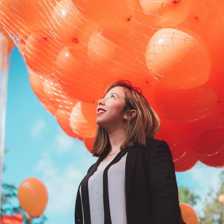 Kaveri Mehta, Lead Design Curator at PlainStudioHub, reviewing corporate floral arrangements